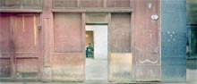 Photograph of woman in distant courtyard  in house Havana, Cuba 1997