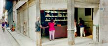 photograph of people on street outside shop in Havana Cuba 1997
