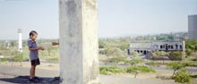 Photograph of Children on rooftop old bulding from earthquake Managua Nicaragua 1997