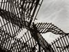 photograph of fence and shadows of fence on beach