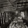 photograph of coal mine cutting coal at the coal face with chocks supporting the roof